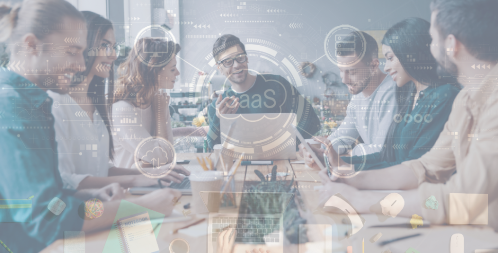 team sitting at a table with SaaS cogs faded over the image